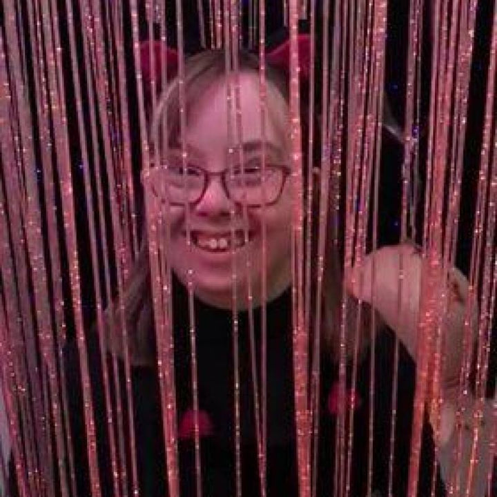 TFH Fibre Optic Waterfall front view with a child engaging with the cascading colour-changing fibre optic tails, demonstrating the tactile and visual sensory experience