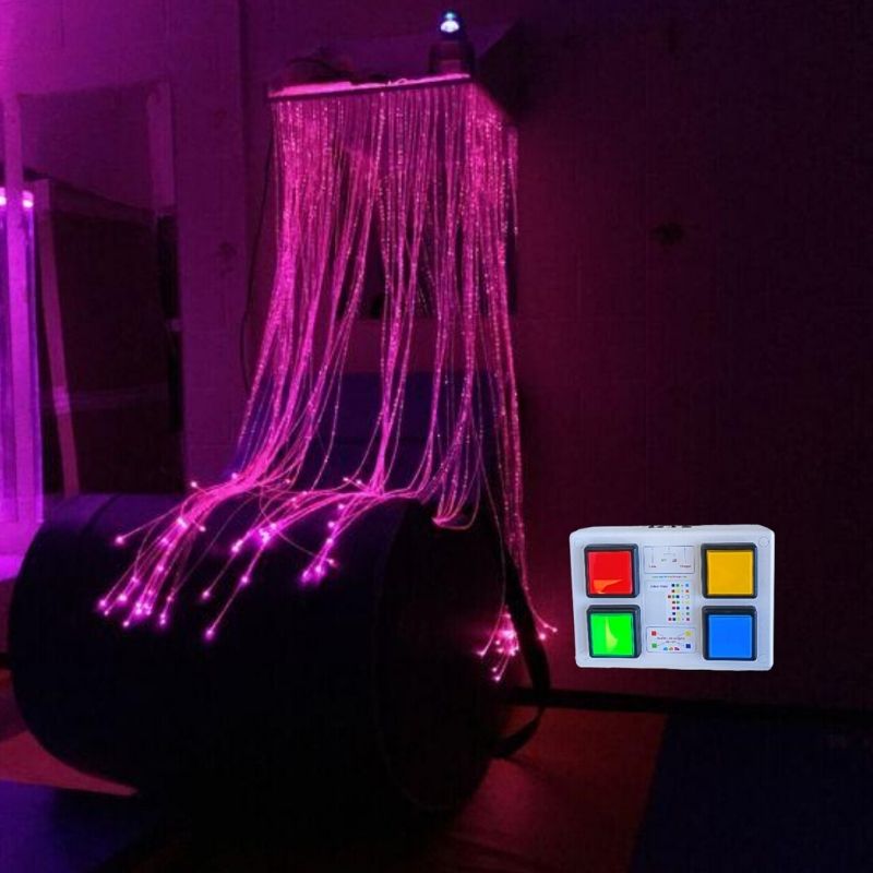 TFH Fibre Optic Waterfall Wireless Button Box System showing pink fibre optic tails cascading with a hand holding the 4-button wireless colour controller for sensory room use