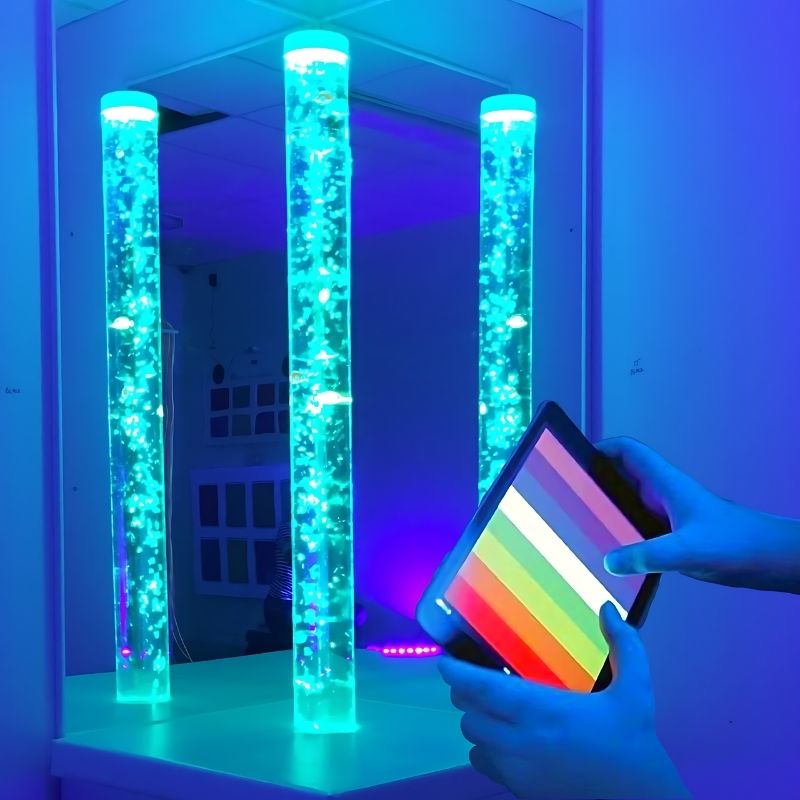 TFH Genie System Bubble Tube with Magic Genie app on iPad showing app-controlled sensory room bubble tube colour selection