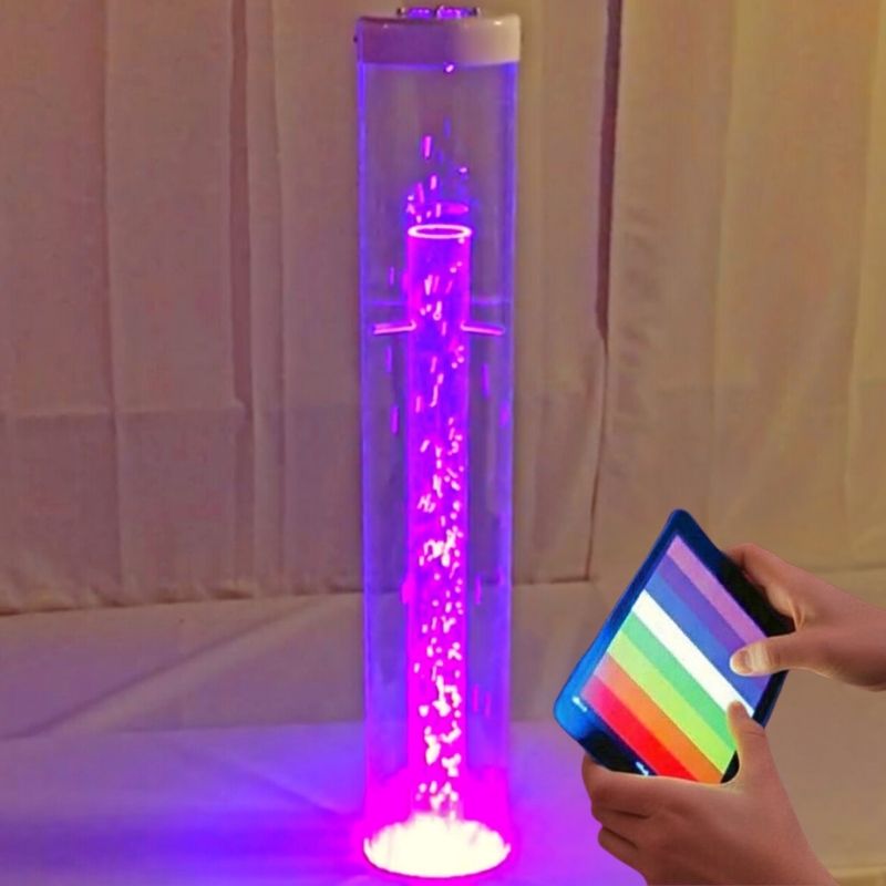 TFH Genie Whirlwind Tube and Base Kit Waterless 48-inch variant in purple light with a user holding the MSE Genie App colour controller, showing Bluetooth waterless sensory column in a sensory room