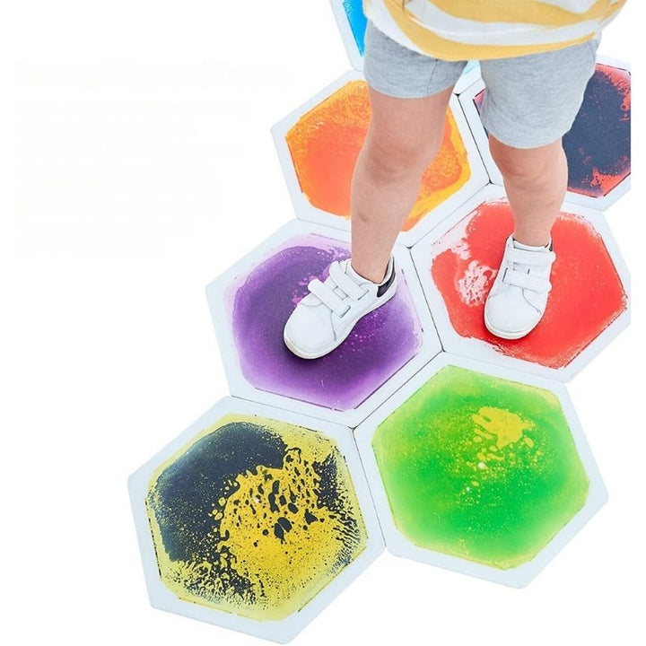 TFH Hexagon Liquid Floor Tiles 9 Set viewed from above, showing the seamless hexagon arrangement and colour-shifting liquid gel in each 13" x 13" sensory tile