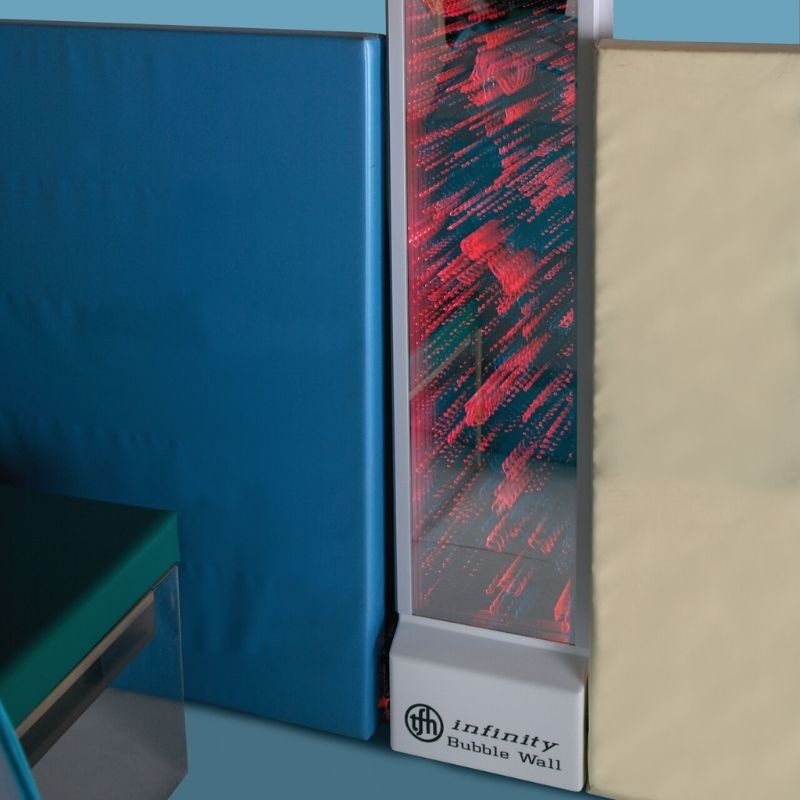 TFH Infinity Bubble Wall illuminated in red in an indoor sensory room setting, creating a calming colour environment for therapy and self-regulation
