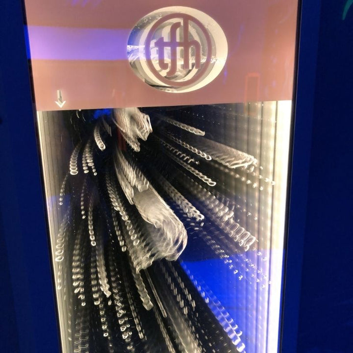 Front view of the TFH Infinity Bubble Wall showing rising water bubbles and colour-changing LED lights for multi-sensory room environments