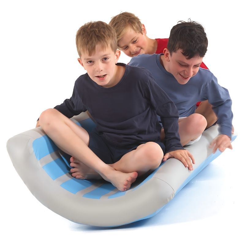 TFH Soft Inflatable Body Rocker with three children actively rocking together, demonstrating cooperative vestibular play