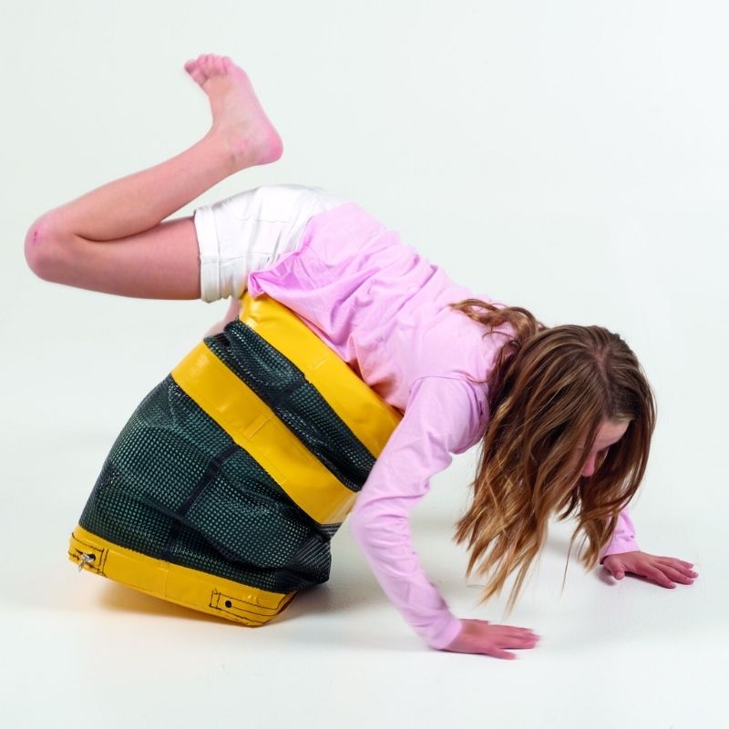 Girl using the TFH Jiggler Balance Seat Stool for active seating, demonstrating vestibular and proprioceptive engagement through spring-loaded balance