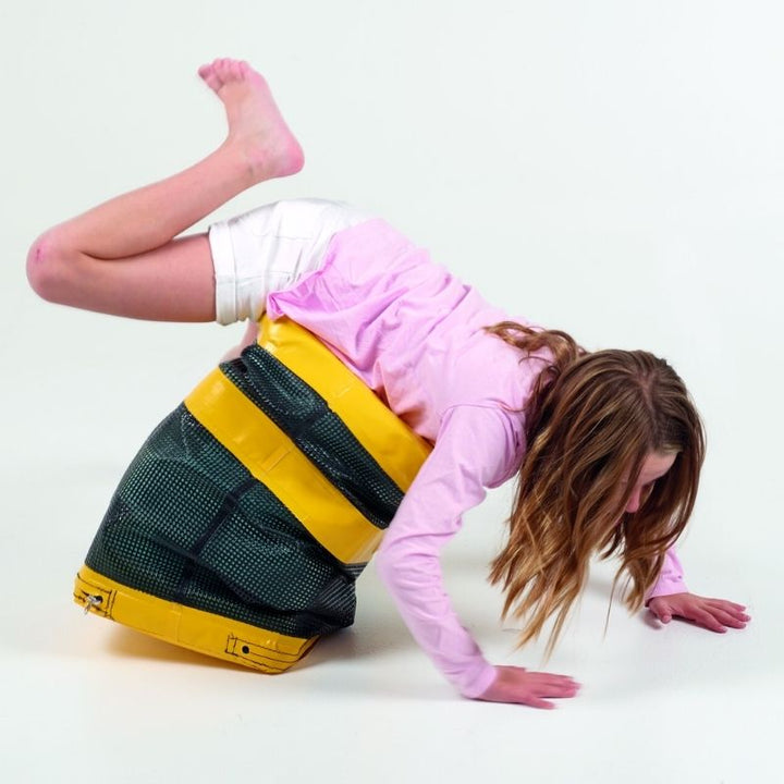 Girl using the TFH Jiggler Balance Seat Stool for active seating, demonstrating vestibular and proprioceptive engagement through spring-loaded balance