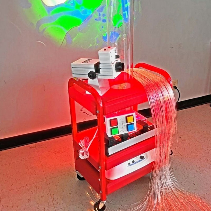 TFH Little Red Sensory Cart Deluxe Water landscape view showing the portable sensory cart with bubble tube, projector and fibre optic tails in a clinical or therapy room setting