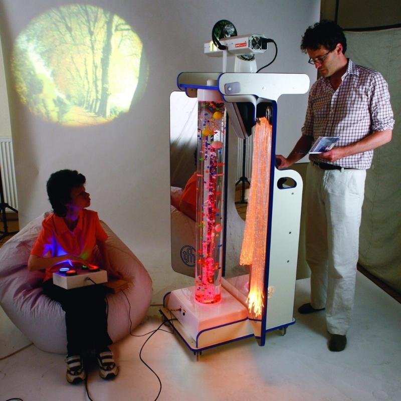 Two adults using the 4-Button Colour Controller on the TFH Mobile Sensory Cart Deluxe during a portable multi-sensory session