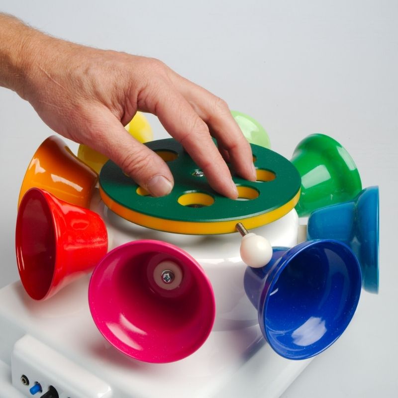 TFH Rainbow Carousel Bells rotating in motion, producing an 8-note musical scale and visual stimulation through vibrant coloured bell movement