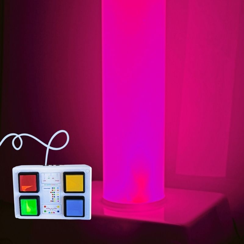 TFH Rainbow Frosted Tube glowing in pink light with the included wired colour control button box, showing the interactive colour selection feature of the waterless sensory light column