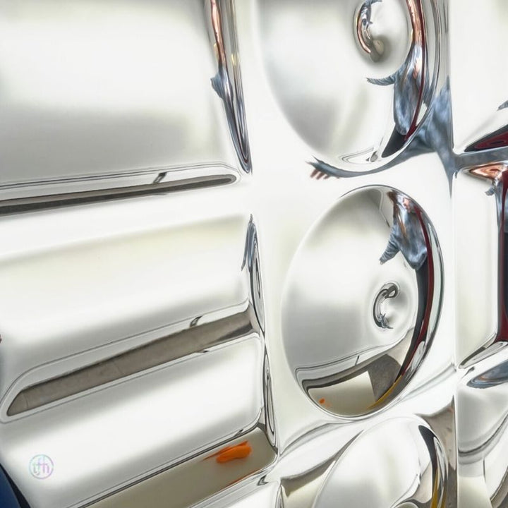Close-up of the TFH Sensory Mirror With Padded Frame showing the nine curved acrylic distortion surfaces surrounded by the soft safety-padded colourful frame