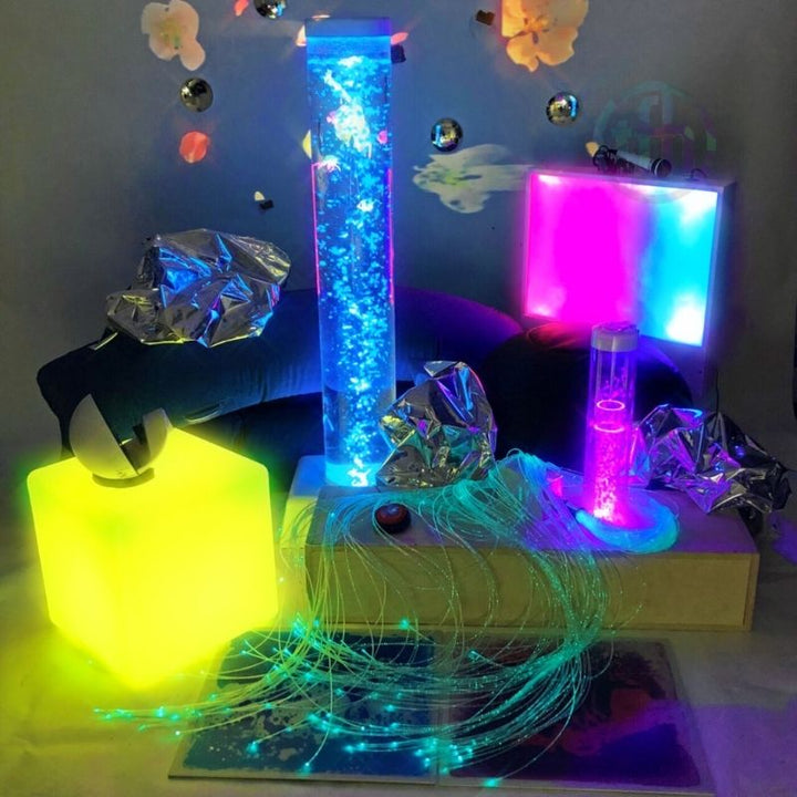 TFH Sensory Room Kit Enhanced Package displayed with blue light bubble tube showing the full multi-sensory room environment in use