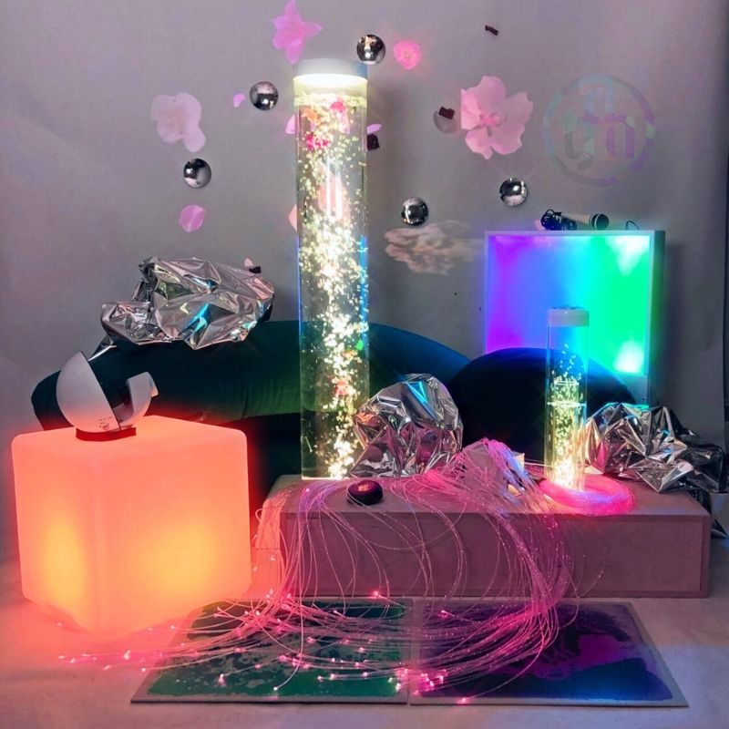 TFH Sensory Room Kit Enhanced Package on grey background showing all 12 multi-sensory room equipment components including fibre optic tails and sounds to lights panel