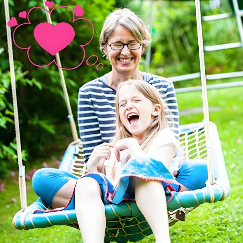 Parent and child using the TFH Sky Cruiser Net Swing together, showing the framed hammock sensory swing's capacity for shared vestibular play