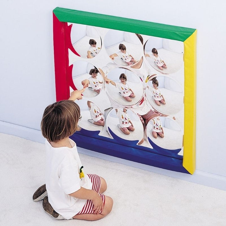 TFH Soft Frame Bubble Mirror with child exploring distorted convex reflections, a 34-inch 9-bubble acrylic sensory room mirror for visual stimulation and spatial awareness development