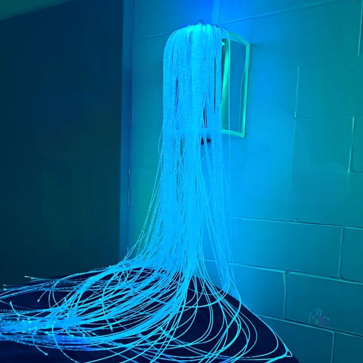 TFH Fibre Optic Tails with Sparkle Light Source glowing in blue tones, showing the colour-changing sensory light effect