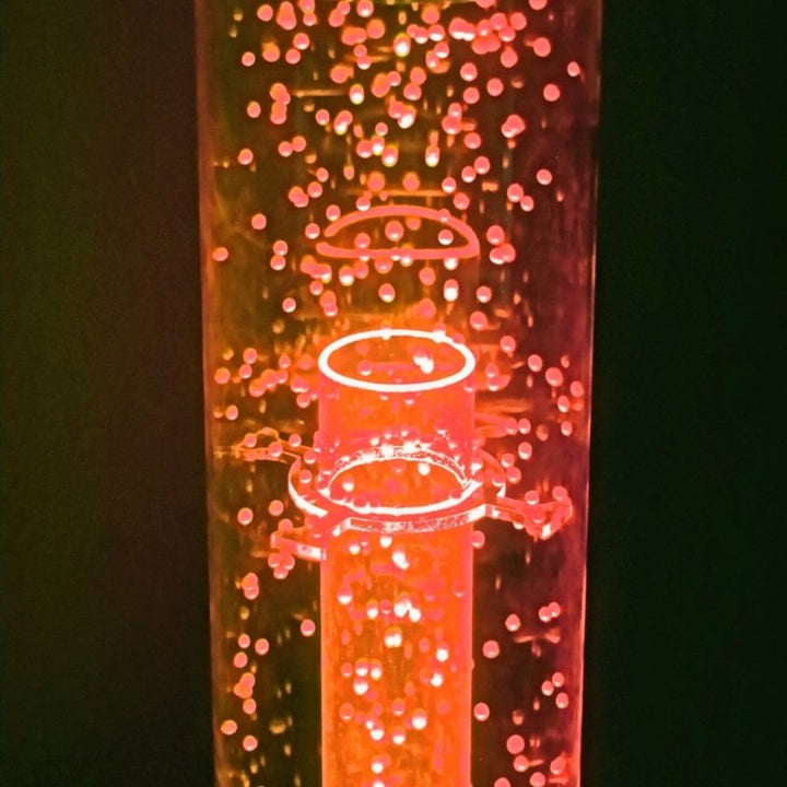 Child interacting with the TFH Tabletop Hurricane Tube Waterless, demonstrating the airflow grill feature for cause-and-effect sensory engagement