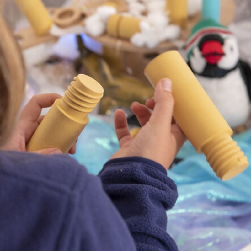Child playing independently with TTS Alice Sharp's Eco Build a World 86-piece construction set, building a small world scene and developing creative problem-solving skills
