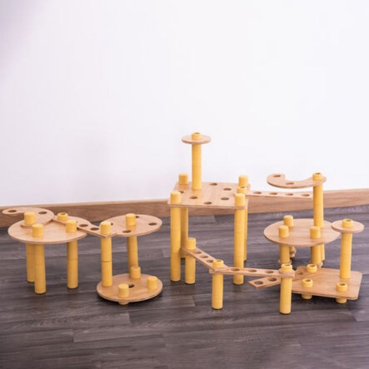TTS Alice Sharp Eco Build a World pieces arranged into pathways and sculptures, showcasing the open-ended construction possibilities of this sustainable loose parts set