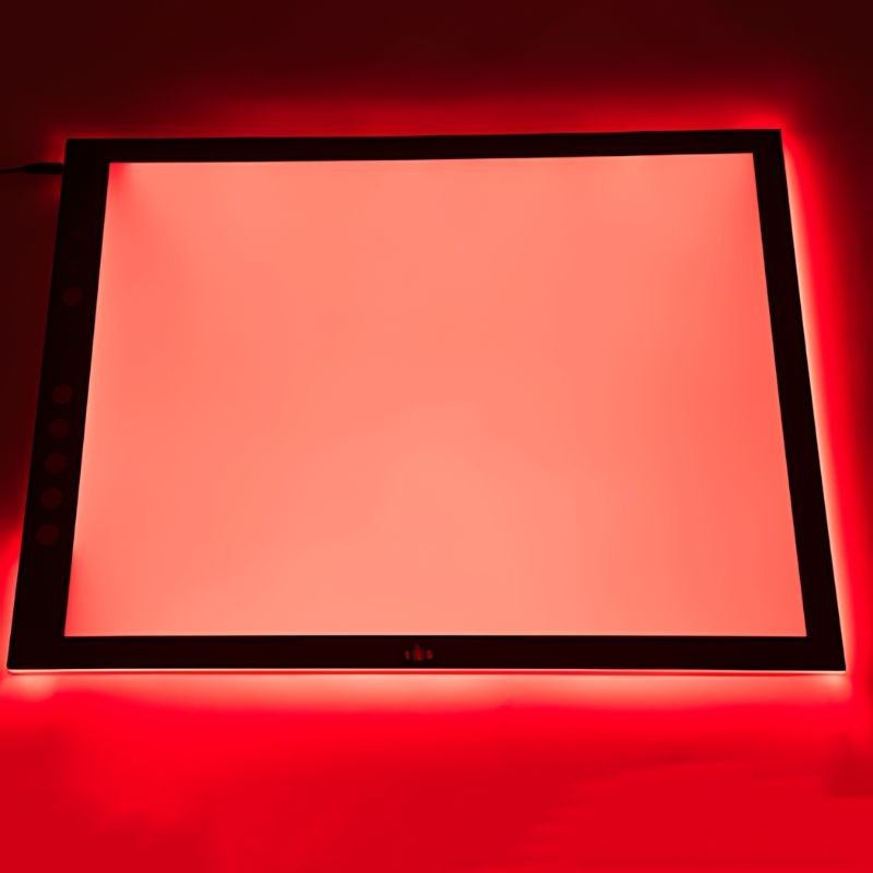 Top view of the TTS Colour Changing Light Panel illuminated in red, showing the even LED surface ideal for colour exploration and sensory play