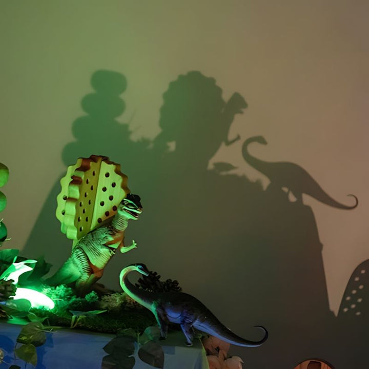 TTS Early Years Projector projecting large dinosaur shadows onto a wall during small world play, demonstrating open-ended STEAM and sensory exploration for early childhood settings