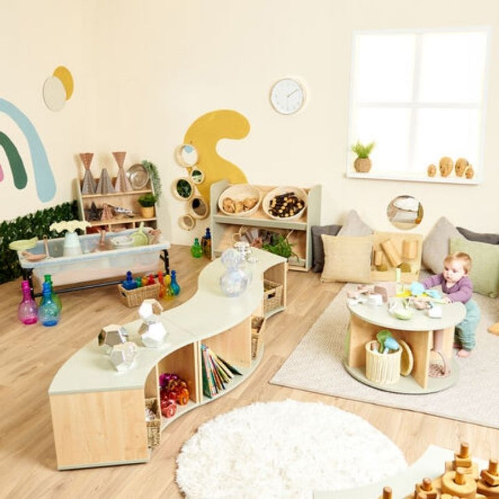 TTS Elements Sage Toddler Low Curved Storage Unit set up in an indoor early years classroom environment