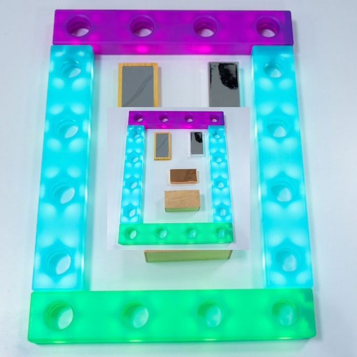 TTS Stack and Build Glow Blocks arranged as an illuminated enclosure with mirrors and loose parts inside, supporting schema play, imaginative construction, and sensory light exploration