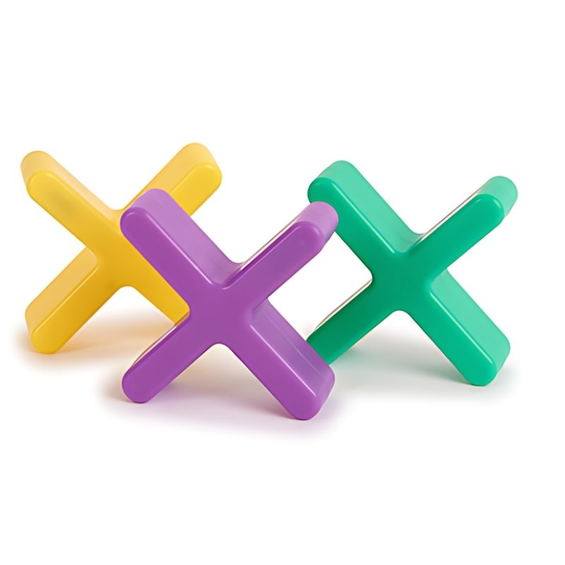 Three TTS Glow Crosses in yellow, purple, and green shown unlit on a white background, displaying the durable child-safe construction of the rechargeable sensory toy