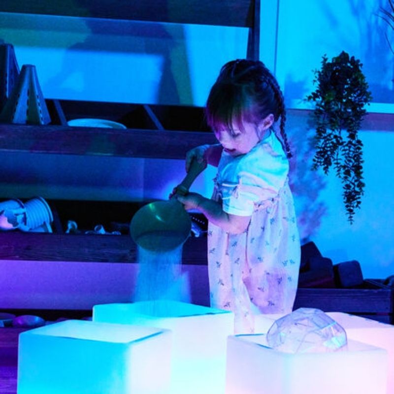 TTS Glow Cube Set of 4 arranged for small group sensory play, showing individual cube stations for independent and collaborative early years activities