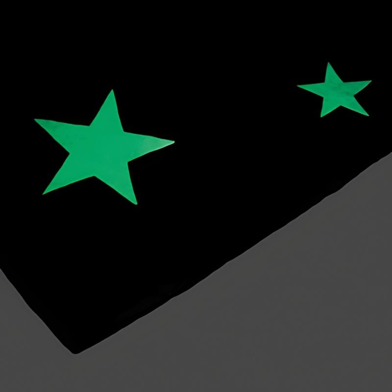Close-up of the TTS Glow in the Dark Mat polyester surface showing the phosphorescent glow texture used for visual sensory stimulation