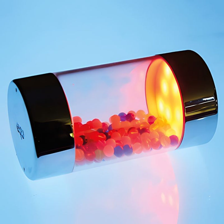 Close-up of a TTS Illuminated Glow Roller Shaker showing the LED light detail inside the metallic cylinder sensory toy