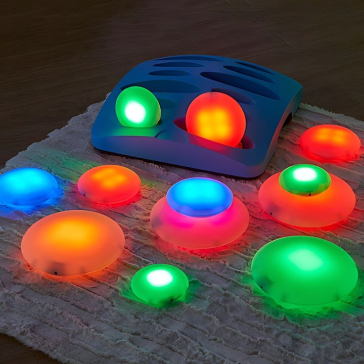 TTS Sensory ICT Glow Set rollers and docking station in landscape orientation, illustrating the rechargeable sensory light storage solution