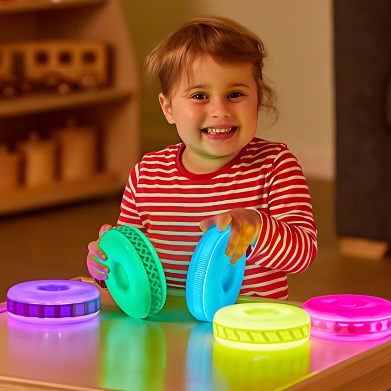 TTS Glow Stacking Discs displayed as a set, showing the light-up rechargeable sensory stacking toy for early years tactile and visual play