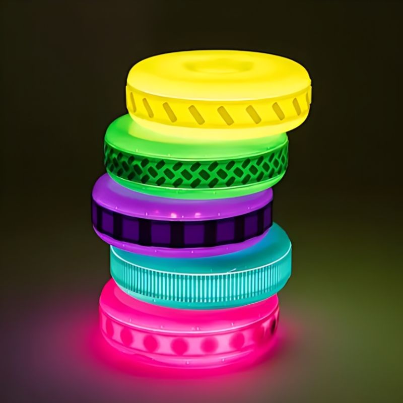 Close-up of TTS Glow Stacking Discs showing the uniquely textured silicone bands that support tactile sensory exploration and fine motor development