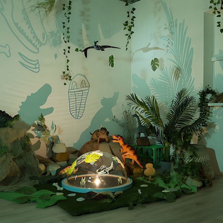 TTS Immersive Projector creating dinosaur shadow projections on wall, demonstrating imaginative early years STEAM play