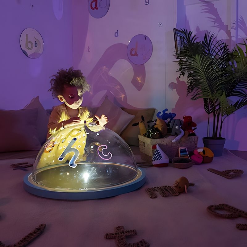 TTS Immersive Projector front view showing child engaged in active sensory light and shadow play in indoor setting