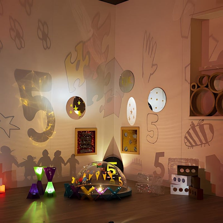 TTS Immersive Projector projecting number 5 shadow onto wall, supporting early numeracy and EYFS curriculum learning