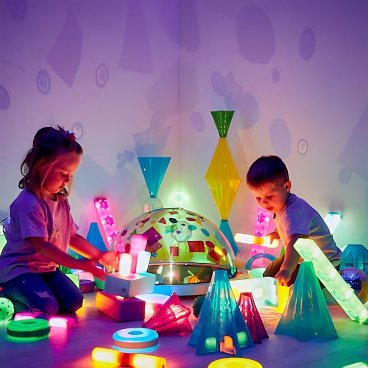 TTS Immersive Projector creating immersive purple light effects during collaborative early years sensory play