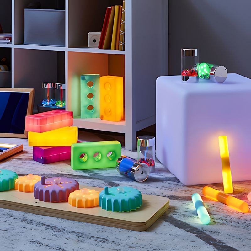 TTS Light Up Cog Board positioned on the floor for flexible early years sensory play and motor skill development