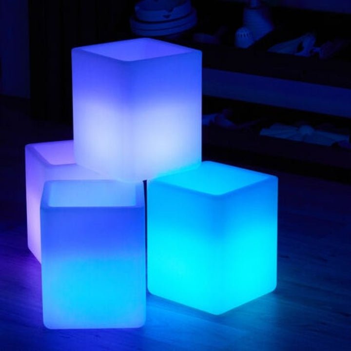 TTS Messy Play Glow Cubes supporting STEAM exploration, with children using materials inside the illuminated waterproof play space