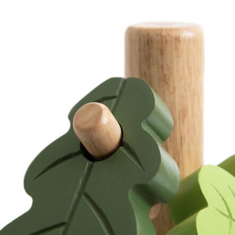 Detailed view of TTS Outdoor Posting Tree seasonal leaf shapes in rubber wood, used for sorting, colour recognition and early years tactile play