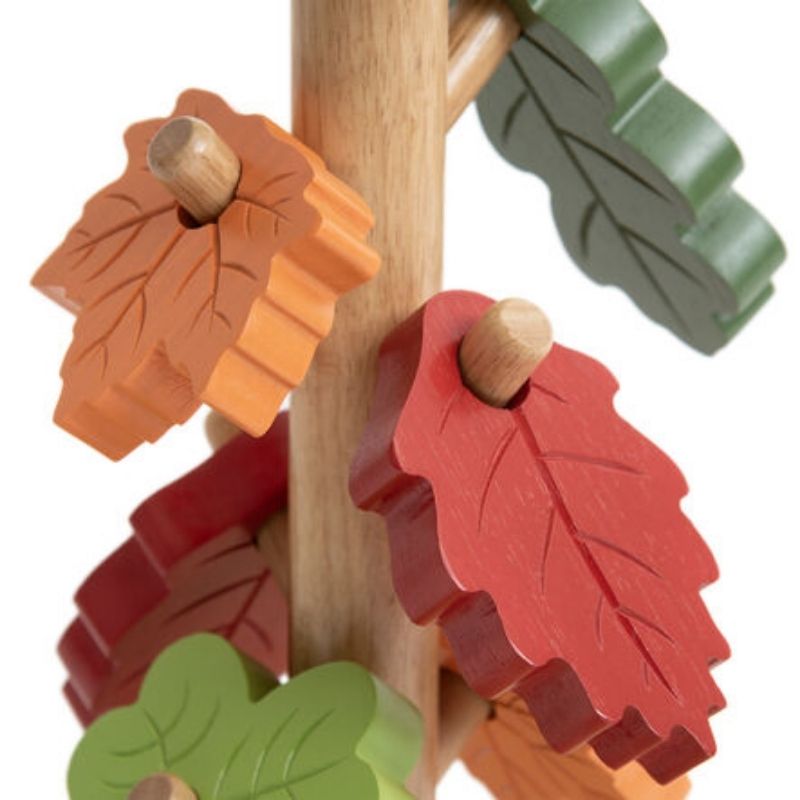 Close-up of TTS Outdoor Posting Tree tactile wooden leaf, showing texture and shape for sensory exploration and fine motor grip development