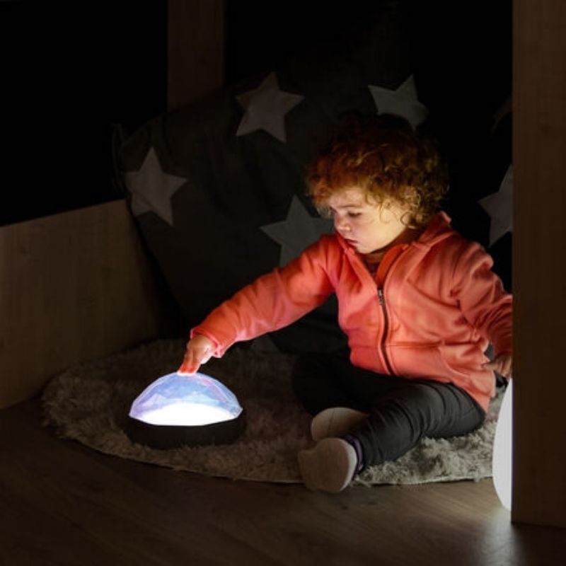 TTS Light Up Recordable Domes 4pk glowing blue against a stars background, illustrating the visual stimulation and sensory light environment these domes create