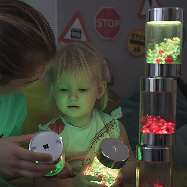 Child and parent exploring the TTS Sensory ICT Glow Set together, demonstrating tactile and visual sensory engagement through light-up play
