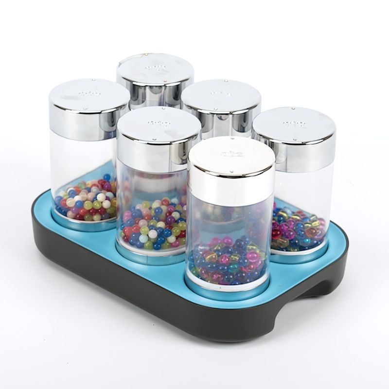 TTS Sensory ICT Glow Set laid out cleanly showing all 22 rechargeable sensory components including glow pebbles, rollers, and illuminated boards
