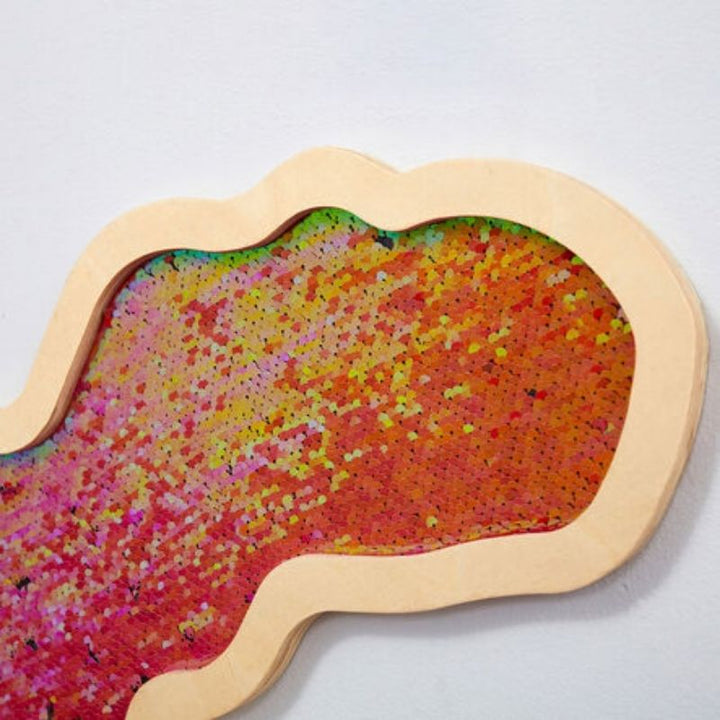 Detail view of the TTS Mark Making Sequin Tyrannosaurus board with flip sequin surface for fine motor skills and mark making activities