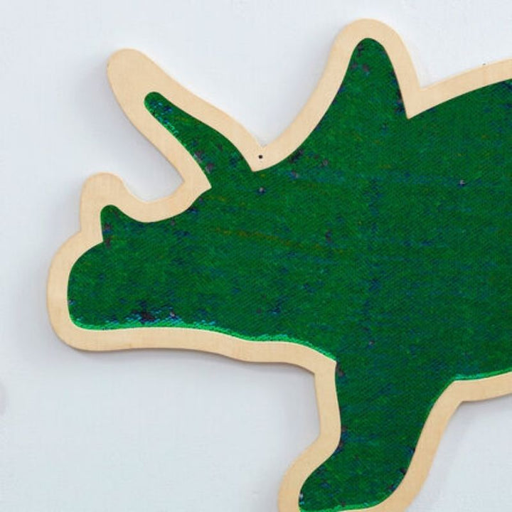 Close-up detail of the TTS Mark Making Sequin Triceratops board showing green colourful flip sequins for tactile sensory play