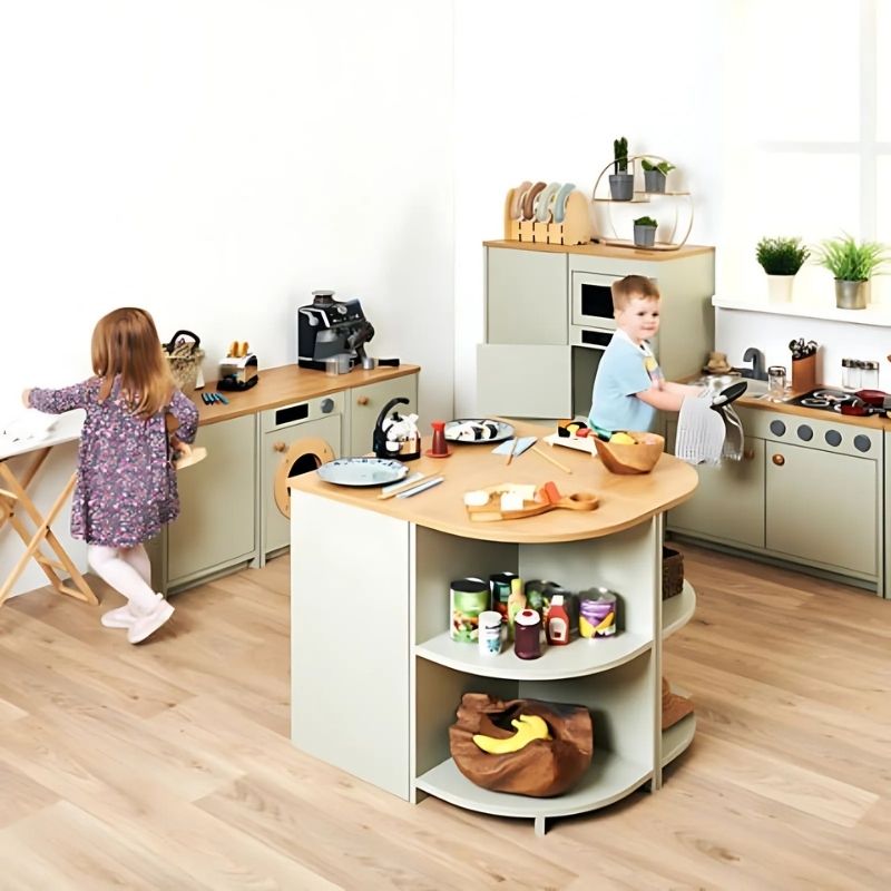 Two children engaged in imaginative role play with the TTS Modern Living Washing Machine Sage in an indoor early years setting