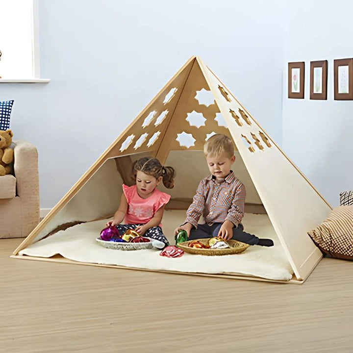 Three children playing inside the TTS Wooden Pyramid Den, a sensory den for kids featuring mirrored walls and customisable cut-out shapes