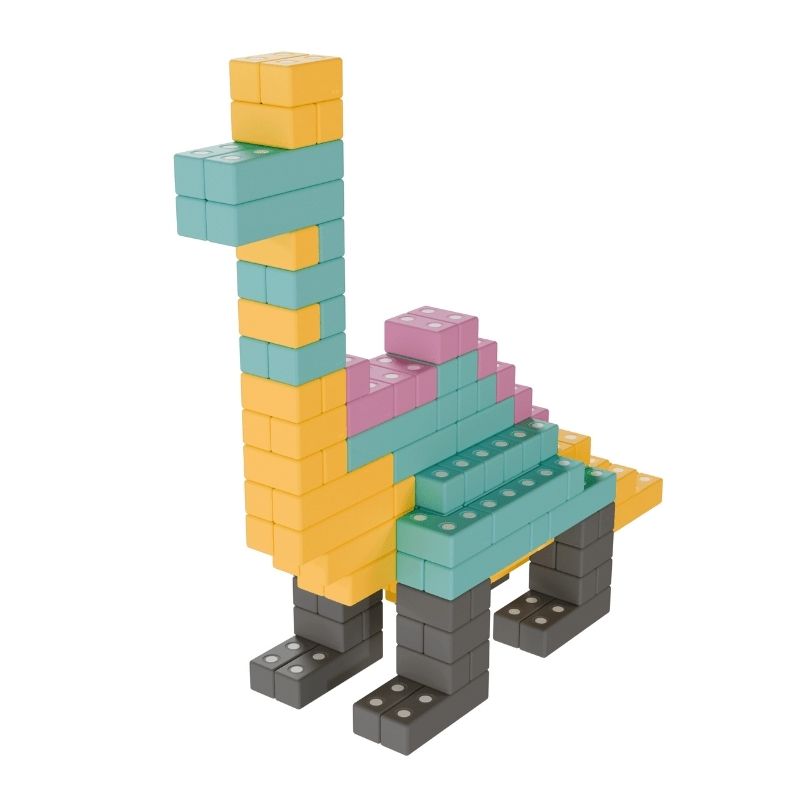 TUKI BIG Magnetic Blocks Builder 110 arranged into a dinosaur figure, demonstrating the maximum construction complexity and multi-section architectural scale that 110 large-format 10cm foam blocks in 8 Signature shapes enables for large-group floor building sessions with 6-9 children